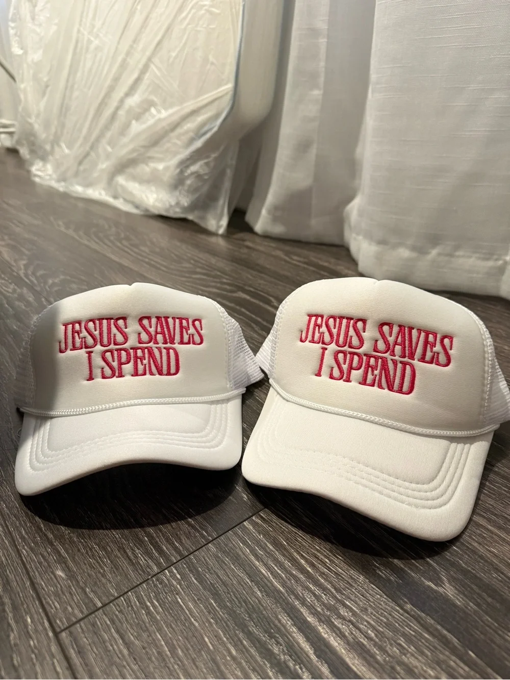 White Trucker Hat with Red Embroidery - 'Jesus Saves I Spend'